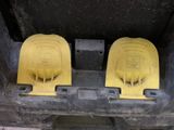 two yellow plastic seats in the back of a truck