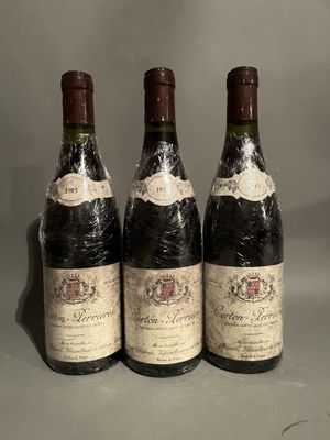 three bottles of wine sitting on top of a table next to each other