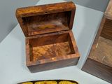 a small wooden box and a small wooden box on a table