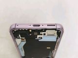 a close up of a cell phone with a broken screen