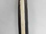 a black and white object on a white surface