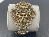 a close up of a bracelet on a display on a table