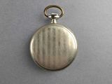 an old silver pocket watch with a chain hanging from it ' s side