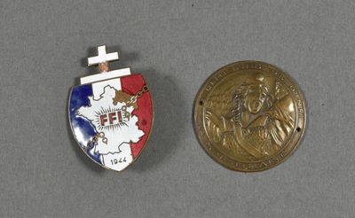 an image of a medal and a coin on a table