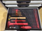 a tool box with tools in it on a table