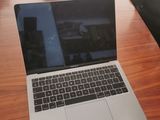 a laptop that is sitting on a table in front of a camera