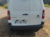 a white van parked on the side of the road