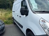 a white van that is parked next to a black car