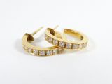a pair of diamond hoop earrings on a white background