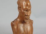 an image of a wooden bust of a man on a white background