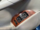 a close up of a car ' s interior with a remote control