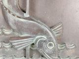 a fish that is on the side of a building