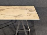 a white marble top table with a metal base