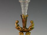 a glass vase that is sitting on a stand
