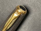 a close up of a fountain pen with a gold nib