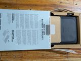 a box with a phone inside of it on a table