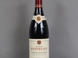 a bottle of wine that is sitting on a table