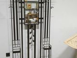 a metal shelf with a mirror and a umbrella on it