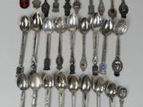 many spoons that are hanging on the wall