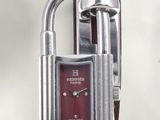 a red watch with a padlock attached to it