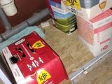 a box of beer sitting on the floor next to a box of beer