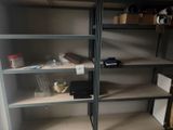 a shelf with many items on it in a room