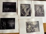 several old black and white pictures of people on a table