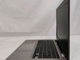 an open laptop computer sitting on top of a white table