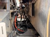 a close up view of a train engine with wires attached to it