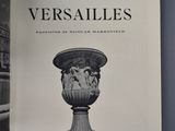 an open book with a black and white image of a vase