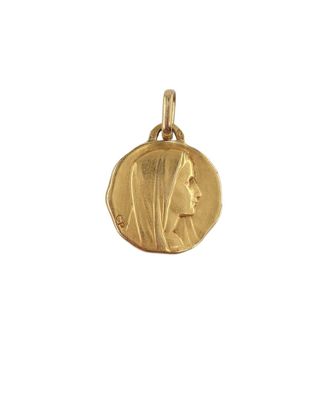 a close up of a gold coin with a woman ' s face on it