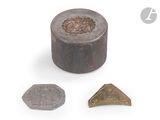 a close up of a metal object with a small metal object in the background