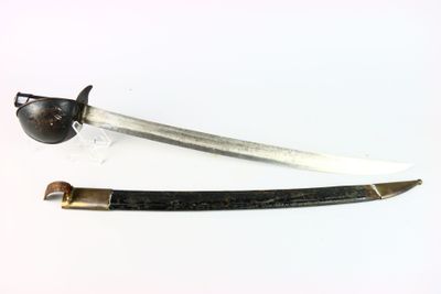 pair of antique swords on a white surface with a black handle