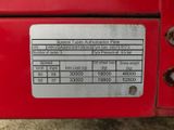 a close up of the back of a red truck