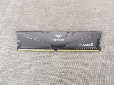 a close up of a memory module on a gray surface