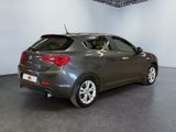 a picture of a grey car in a showroom