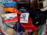 a basket full of toys and other items for a child ' s play