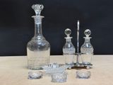 a lot of glass items on a table with a black background