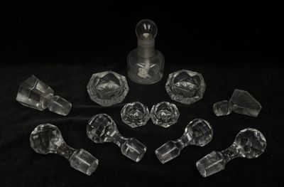 a lot of clear glass pieces on a black surface