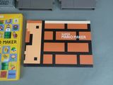 a nintendo game and a nintendo game controller on a table