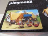 a box of playmobil with a picture of a house and a car