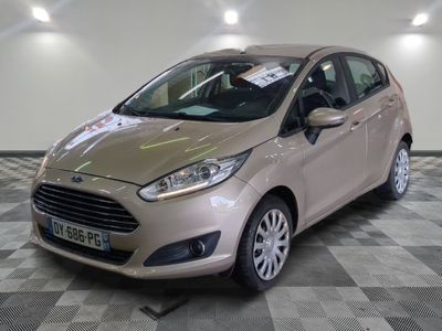 the car is parked on the checkered floor in the showroom