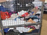 a metal cart filled with lots of stuff in a warehouse