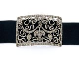 a close up of a black belt with a silver buckle