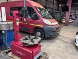a red van that is parked in a garage