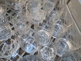 a lot of empty glasses on a tray on the table