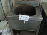 a dirty sink in a dirty room with a price tag on it