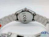 a close up of a wrist watch on a white surface