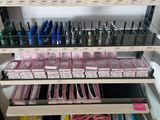 many bottles of nail polish on the shelves in the store