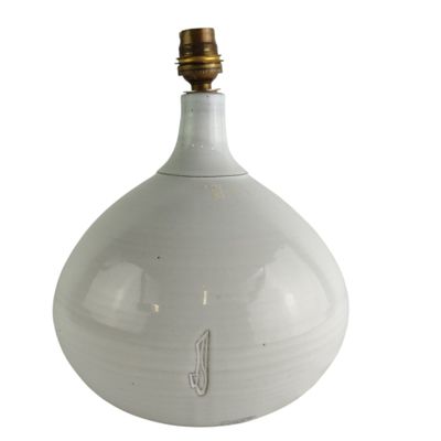 an image of a white vase with a light on it